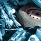 Illustration for article titled How Do You Feel About Spare Tires Jammed In The Engine Bay?